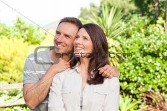 Beautiful woman with her husband in the garden