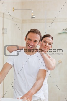 Couple hugging in the bathroom