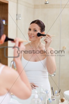 Beautiful women putting make up on 