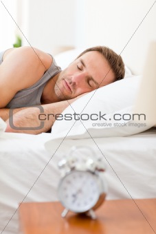 Relaxing man sleeping in his bed