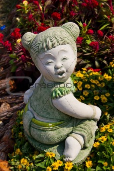 Child statue in the garden.