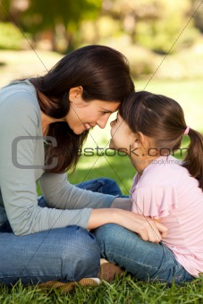 Happy mother with her daughter in the park