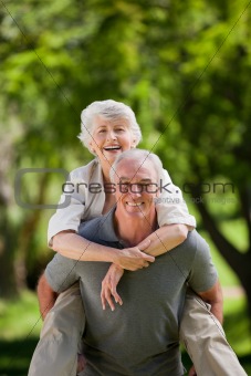 Man giving wife a piggyback