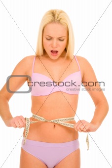 woman measuring the waist with a tape