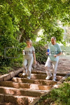 Couple running in the wood