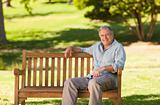 Elderly man sitting on a bench