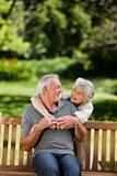 Mature couple hugging in the garden