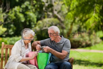 Retired couple with shopping bags