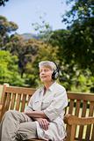 Elderly woman listening to some music