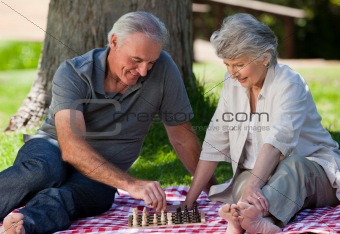 Mature couple  picnicking in the garden 