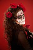 Woman with face paint in Day of the Dead style