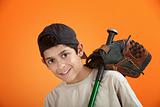 Young boy with baseball glove and bat