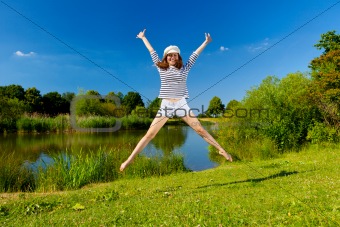 young woman exercising outdoor in summer