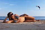 girl lying on a beach