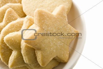 Star shaped homemade cookies in a white plate