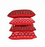 Red cushions stacked up on a white background