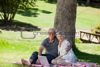 Senior couple  picnicking in the garden 