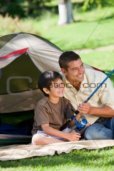 Son fishing with his father