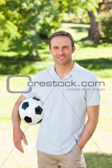 Handsome man with a ball