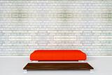 Couch on white brick wall