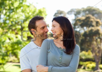 Beautiful couple hugging in the park
