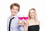 Young couple toasting with pink drink