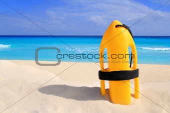Baywatch rescue buoy yellow on tropical beach