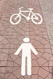 Pedestrian and bicycle symbols.

