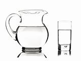 Glass and glass pitcher on white background