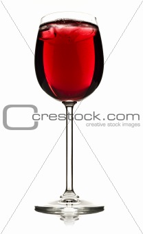 Wine glass with red fruit juice and ice