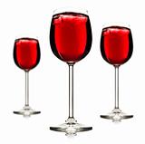 Three wine glasses with red fruit juice and ice