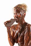 naked blond girl eating chocolate