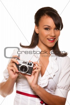 Young mutli-race woman holding retro camera