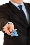 Businessman giving credit card.  Close-up.
