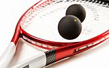 Close up of a red and silver squash racket and ball on a white background with space for text