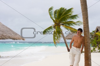 Young man on a tropical beach