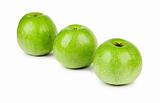 Three ripe and juicy green apples located in a line isolated on a white background