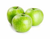 Three ripe and juicy green apples nearby with each other isolated on a white background