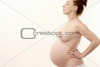 pregnant woman profile nude on white