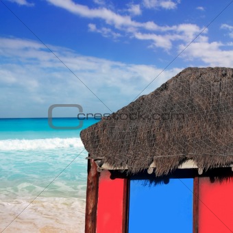 hut palapa in beach turquoise caribbean blue sky