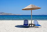Greece. Kos island. Two chairs and umbrella on the beach