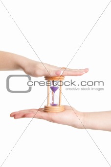 man and woman hands holding Hour Glass