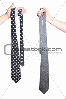 two hand holding tie's