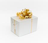 White gift with gold bow