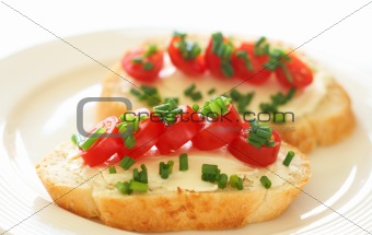 Tasty sandwich with cream cheese and tomatoes