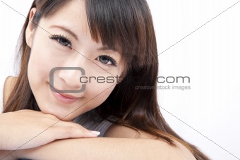 Closeup portrait of a smiling  young asian woman isolated on white background