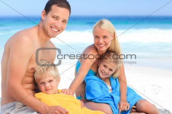 Parents with their children in their towels