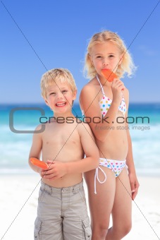 Brother and sister eating an ice cream