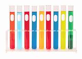 Various glass test tubes in holder isolated on the white backgro