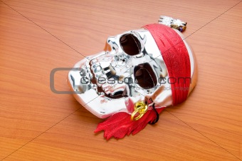 Skull mask isolated on the wooden background